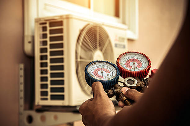 Professional Heat Pump Repair technician working in Portage, IN